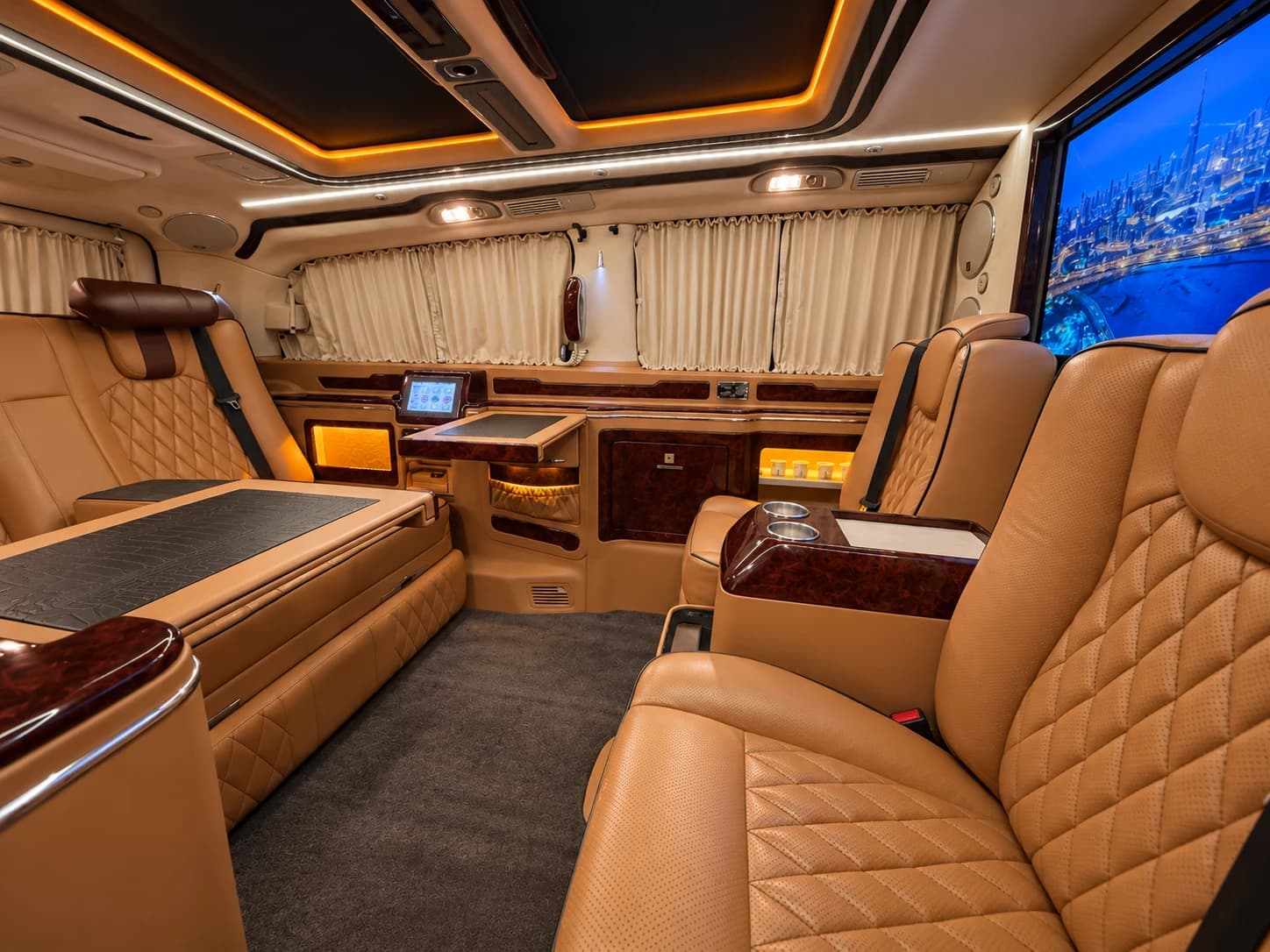 Work tables and captain chairs inside the Jet Van VIP